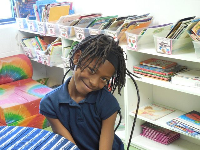 NorthSideComm-3 Child posing in donation center